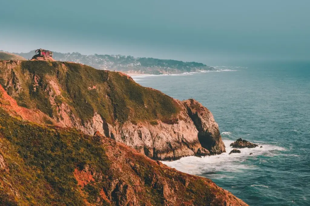 small red shack on top of cliff