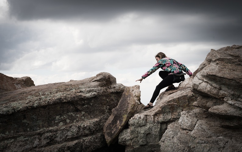 woman rock climbing