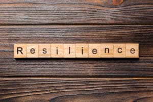 letter tiles forming the word resilience